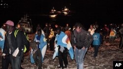 Migrants arrive on the tiny island of Lampedusa, Italy, May 8, 2011