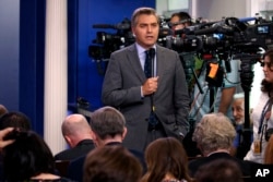FILE - CNN reporter Jim Acosta does a stand-up before the daily press briefing at the White House, in Washington, Aug. 2, 2018.