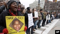 FILE - Demonstrators blocking Public Square in Cleveland during a protest over the police shooting of 12-year-old Tamir Rice, Nov. 25, 2014.