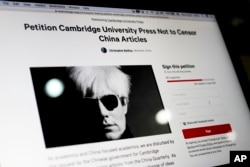 FILE - A computer screen shows an online petition page urging Cambridge University Press to restore more than 300 politically sensitive articles removed from its website in China after a request from authorities, in Beijing, Aug. 21, 2017.