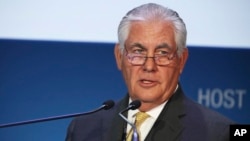 FILE - ExxonMobil CEO and chairman Rex Tillerson gives a speech at the annual Abu Dhabi International Petroleum Exhibition & Conference in Abu Dhabi, United Arab Emirates, Nov. 7, 2016. 