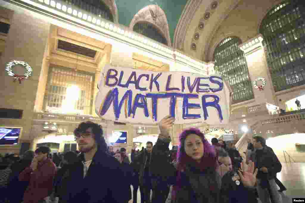 Demonstrators protest to demand justice for the death of Eric Garner, at Grand Central Terminal in the Manhattan borough of New York, Dec. 9, 2014.