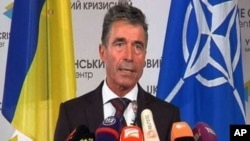 NATO Secretary General Anders Fogh Rasmussen speaks during a media conference at NATO headquarters in Brussels, June 25, 2014.