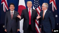 Japan's Prime Minister Shinzo Abe, left, U.S. President Donald Trump and Australia Prime Minister Malcolm Turnbull attend a trilateral meeting during the opening ceremony of the 31st Association of South East Asian Nations (ASEAN) Summit in Manila on Nov. 13, 2017.