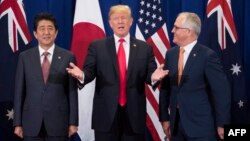 Japan's Prime Minister Shinzo Abe, left, U.S. President Donald Trump and Australia Prime Minister Malcolm Turnbull attend a trilateral meeting during the opening ceremony of the 31st Association of South East Asian Nations (ASEAN) Summit in Manila, Nov. 13, 2017.