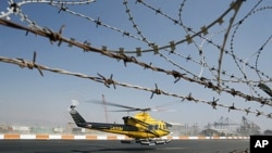 A helicopter ferrying workers to an offshore oil and gas rig belonging to Houston-based Noble Energy Inc. takes off from Cyprus' Limassol port, September 19, 2011.