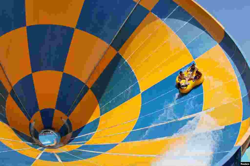 Visitors enjoy a slide at the 37 Degree Dream Sea Waterpark in Yantai, Shandong province, China.