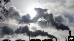 Urgency of Climate Talks Seen in Coal Plants, Garbage Dumps