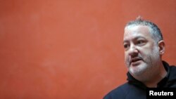 FILE - Spencer Tunick attends a news conference before using the Day of the Dead celebrations as his latest backdrop for mass nude photographs, in San Miguel de Allende, Mexico, Oct. 27, 2016.