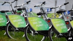 Bicycles reading "save the planet" wait for customers at the COP 23 Fiji UN Climate Change Conference in Bonn, Germany, Nov. 6, 2017. 