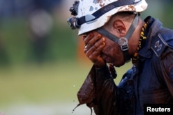 A member of rescue team reacts, upon returning from the mission, after a tailings dam owned by Brazilian mining company Vale SA collapsed, in Brumadinho, Brazil, Jan. 27, 2019.