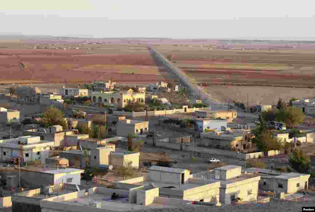 A Kurdish village stands deserted in Kobani after the Islamic State fighters took control of the area, Oct. 7, 2014.