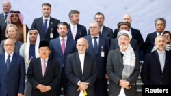 Afghan President Ashraf Ghani poses for a group photo during a peace and security cooperation conference in Kabul, Afghanistan, Feb. 28, 2018.