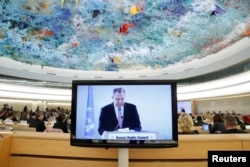 FILE - Russian Foreign Minister Sergey Lavrov is seen on a monitor, speaking at a session of the U.N. Human Rights Council at the United Nations in Geneva, Switzerland, Feb. 28, 2018. Lavrov has been accusing the U.S. of unilateralism.