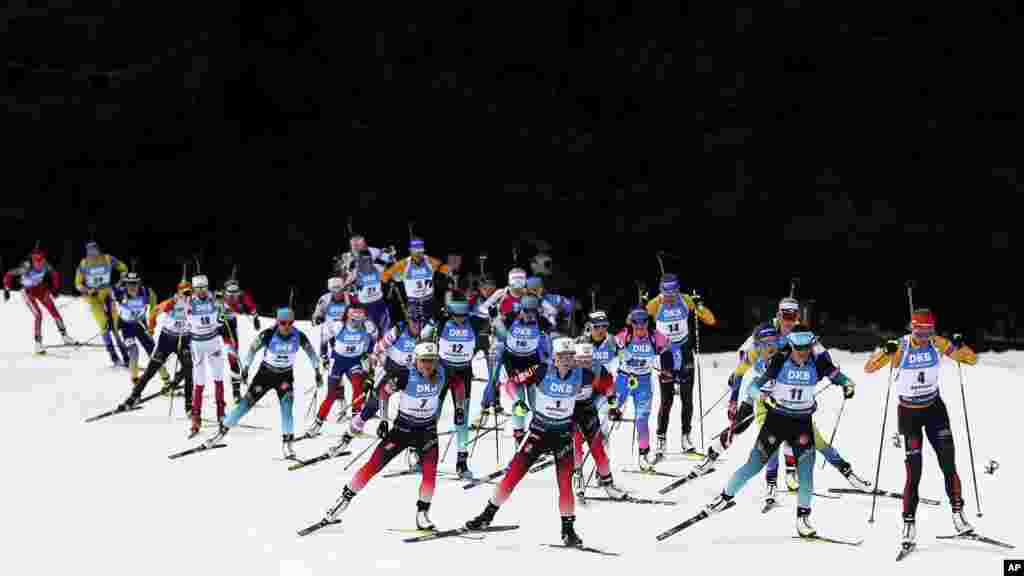 Marte Olsbu Roeiseland of Norway, center, leads during the women&#39;s 12.5 km mass start competition at the Biathlon World Championships in Antholz, Italy.
