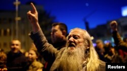 Protesters shout slogans during demonstrations against an agreement that would ensure the wider official use of the Albanian language, in Skopje, Macedonia, March 6, 2017. 
