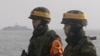 China Steps Up Pressure on Koreas