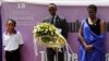 Rwandan President Paul Kagame (2nd from Left) and Rwandan First Lady, Jeanette Kagame, lay a wreath at the Genocide Memorial in Kigali on April 7, 2012.