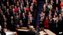 Republicans stand as President Donald Trump delivers his State of the Union address to a joint session of Congress on Capitol Hill in Washington, Tuesday, Feb. 5, 2019. 