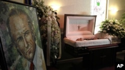 The body of the former Venezuelan president Carlos Andres Perez lies in a casket at a funeral home in Miami, Tuesday, Dec. 28, 2010