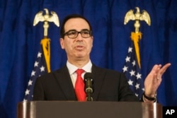 FILE - Treasury Secretary Steven Mnuchin speaks at the Hilton Midtown hotel during the United Nations General Assembly, in New York, Sept. 21, 2017.