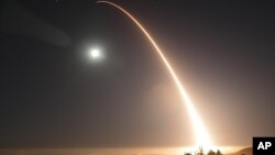 In this image provided by the U.S. Air Force, an unarmed Minuteman 3 intercontinental ballistic missile launches during a test just after midnight, May 3, 2017, at Vandenberg Air Force Base, California.