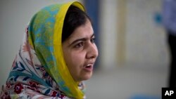 FILE - Nobel Peace Prize laureate Malala Yousafzai, 18, speaks during her visit to Azraq refugee camp in Jordan, July 13, 2015. 