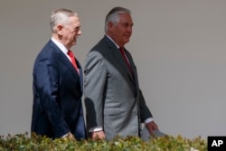 FILE - Defense Secretary Jim Mattis, left, walks with Secretary of State Rex Tillerson at the White House in Washington, April 3, 2017. Mattis and Tillerson will be among officials briefing U.S. senators on North Korea.