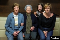 Second from left, Pilar Fernandez, 101, poses with her daughter Pili (L), granddaughter Flori (R) and her great granddaughter Ana in Ambas, Asturias, northern Spain, Oct. 18, 2016.