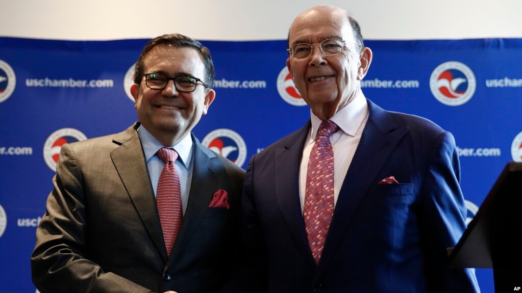 Commerce Secretary Wilbur Ross and Mexico Secretary of the Economy Ildefonso Guajardo Villarreal shake hands after a news conference at the U.S. Chamber of Commerce in Washington, June 6, about Mexico sugar exports.