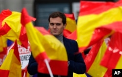 FILE - Leader of the centre right Ciudadanos party, Albert Rivera, addresses the crowd during political meeting demonstrating against Spain's Prime Minister Pedro Sanchez in Madrid, Spain, Saturday, Nov. 24, 2018.