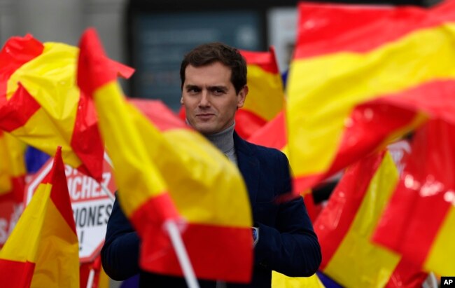 FILE - Leader of the centre right Ciudadanos party, Albert Rivera, addresses the crowd during political meeting demonstrating against Spain's Prime Minister Pedro Sanchez in Madrid, Spain, Saturday, Nov. 24, 2018.