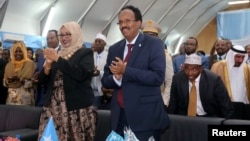 Somalia's newly elected President Mohamed Abdullahi Farmaajo and his wife Zeinab Abdi applaud during his inauguration ceremony in Somalia's capital Mogadishu, Feb. 22, 2017. 