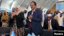 Somalia's newly elected President Mohamed Abdullahi Farmaajo and his wife Zeinab Abdi applaud during his inauguration ceremony in Somalia's capital Mogadishu, Feb. 22, 2017. 