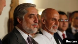 Afghanistan's rival presidential candidates Abdullah Abdullah, left, and Ashraf Ghani announce an audit plan in Kabul on July 12, 2014.