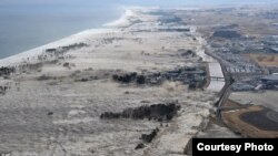 Giant tsunami waves hit coast of Japan.