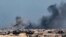 FILE - A picture taken from Rafah shows smoke billowing during Israeli bombardment over Khan Younis in the southern Gaza Strip on February 9, 2024, amid continuing battles between Israel and the Palestinian militant group Hamas. 