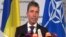 NATO Secretary General Anders Fogh Rasmussen speaks during a media conference at NATO headquarters in Brussels, June 25, 2014.