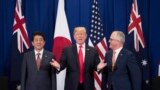 Japan's Prime Minister Shinzo Abe, left, U.S. President Donald Trump and Australia Prime Minister Malcolm Turnbull attend a trilateral meeting during the opening ceremony of the 31st Association of South East Asian Nations (ASEAN) Summit in Manila on Nove