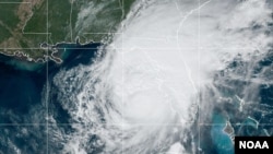 This satellite image by National Oceanic and Atmospheric Administration (NOAA) shows the location of the center of Hurricane Milton as of 1:00 PM EDT on Oct. 9, 2024. Milton is moving NE at 27 km/h with maximum sustained winds of about 250 km/h.