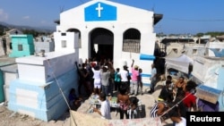 People gather at Our Lady of Sorrows church inside a cemetery during Day of the Dead celebrations, in Port-au-Prince, Haiti November 1, 2021. REUTERS/Ralph Tedy Erol