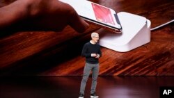 Apple CEO Tim Cook speaks at the Steve Jobs Theater during an event to announce new products, March 25, 2019, in Cupertino, California. 