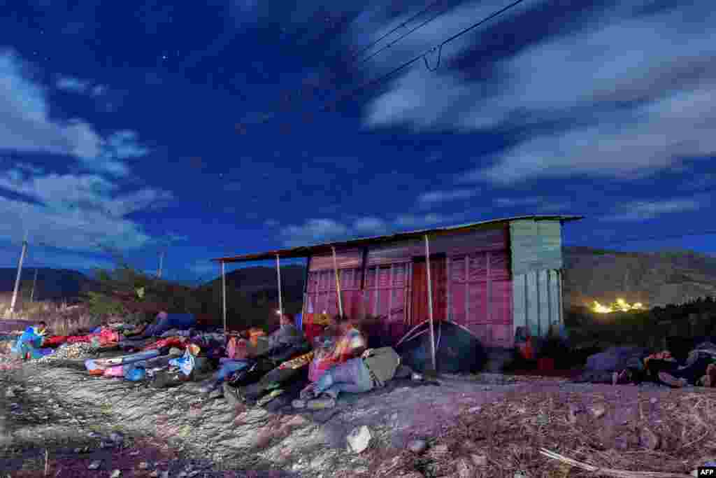 Venezuelan migrants on their way to Peru sleep along the Pan-American Highway between Tulcan and Ibarra in Ecuador, after entering the country from Colombia, Aug. 22, 2018.