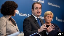 FILE - Yannick Glemarec, center, then with U.N. Women, speaks at the Atlantic Council in Washington, D.C., April 20, 2018.