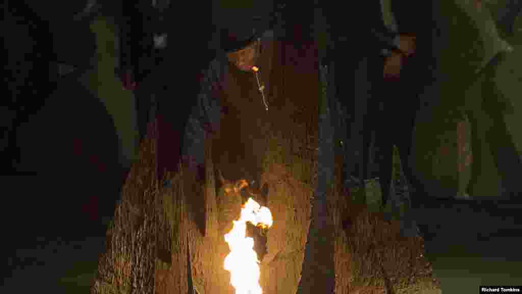 President Jonathan rekindles the eternal flame, commemorating the six million Jews killed by the Nazis in the Holocaust, during a ceremony at the Yad Vashem Holocaust memorial in Jerusalem.