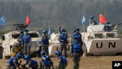 Latihan militer Penjaga Perdamaian PBB "Shared Destiny 2021" di pangkalan pelatihan Operasi Penjaga Perdamaian Queshan di Kabupaten Queshan, provinsi Henan, China tengah, Rabu, 15 September 2021. (AP Photo/Ng Han Guan)