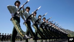 Chinese troops practice marching ahead of a Sept. 3 military parade, on the outskirts of Beijing, Aug. 22, 2015.