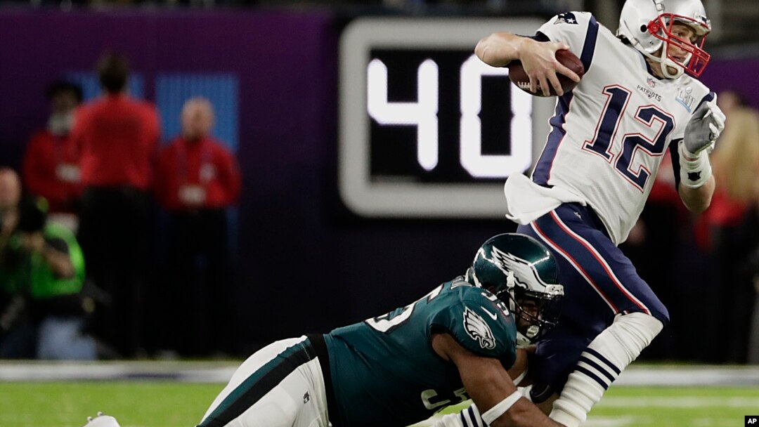 Philadelphia Eagles defensive end Brandon Graham (55) tackles New England Patriots quarterback Tom Brady (12), during the first half of the NFL Super Bowl 52 football game, Sunday, Feb. 4, 2018, in Minneapolis.