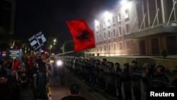 Supporters of the opposition attend an anti-government protest, in front of Albania's Prime Minister Edi Rama's office, in Tirana, Albania, Oct. 7, 2024.