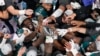 Philadelphia Eagles players celebrate with the Vince Lombardi Trophy after the Eagles won the NFL Super Bowl 59 football game against the Kansas City Chiefs, Feb. 9, 2025, in New Orleans.